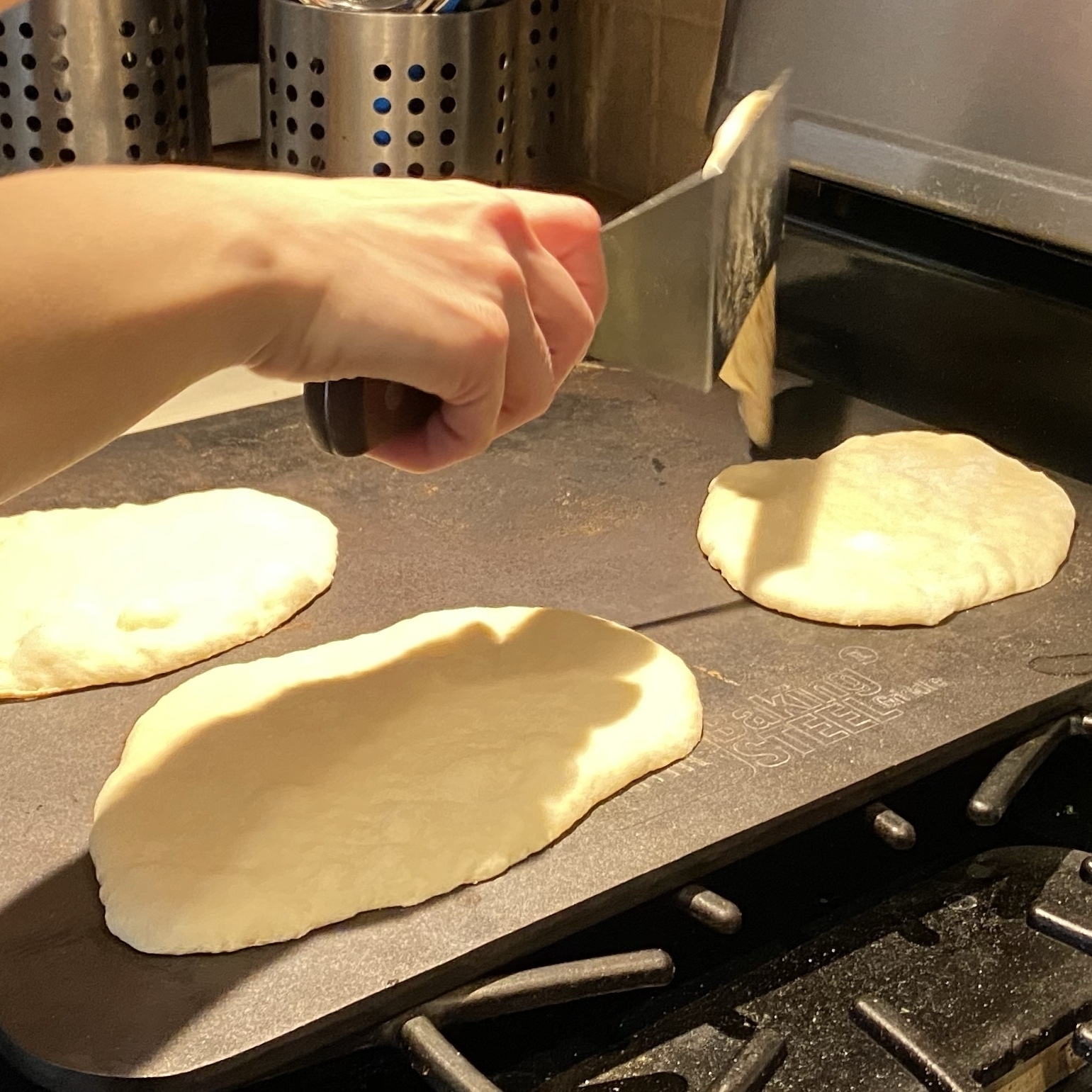 cooking naan on a baking steel
