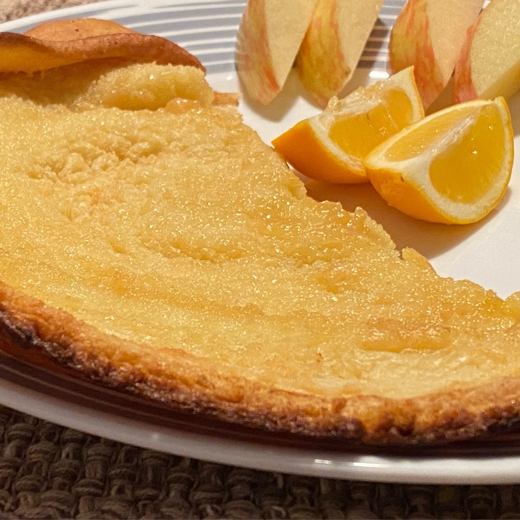 dutch baby served with meyer lemons and apples