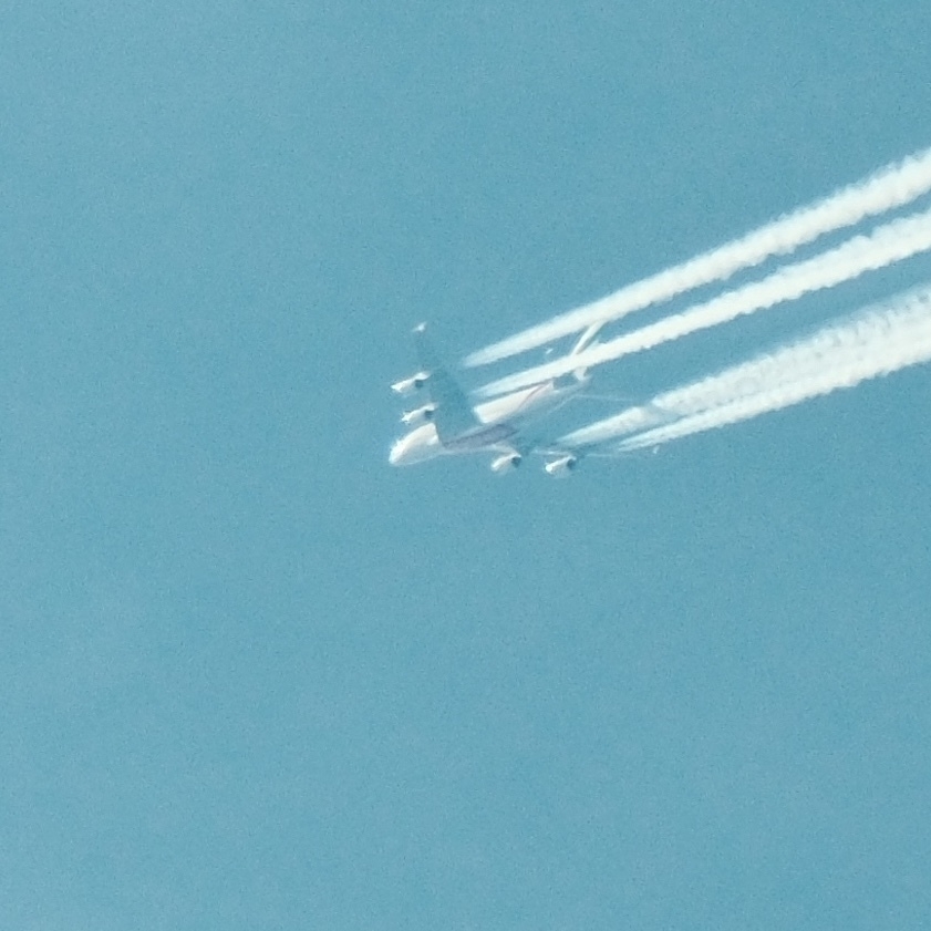 Emirates 380-800 flyover with contrails