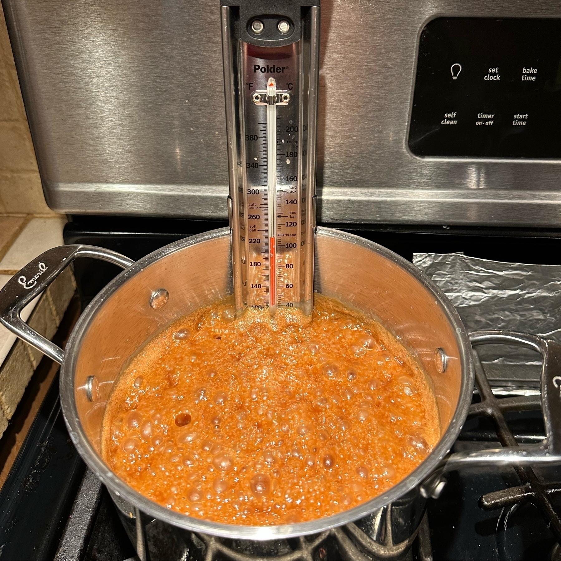 a candy thermometer in a 4 qt sauce pan of almost done caramel colored caramel. At about 230°F