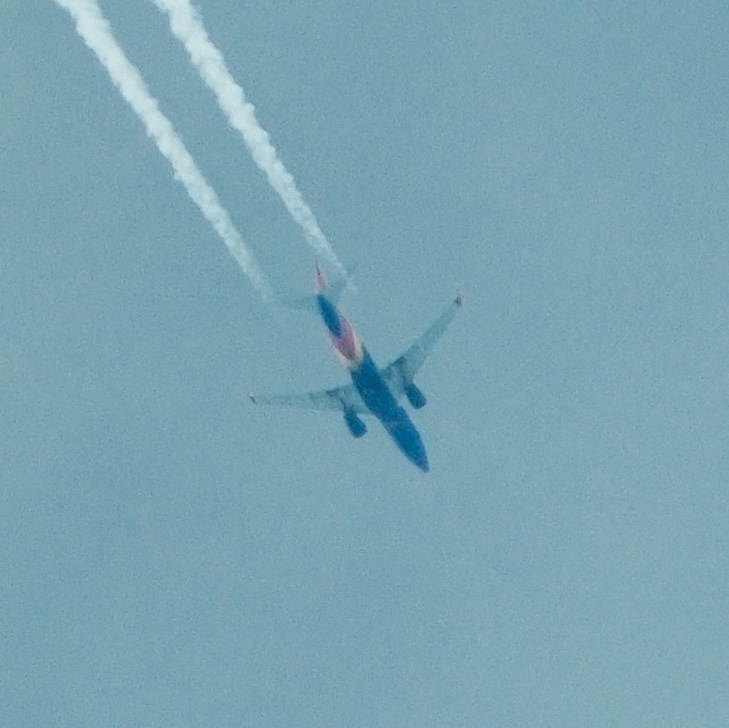 Southwest flyover with contrails