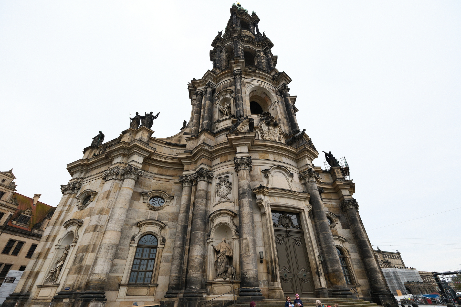 Auto-generated description: A grand, intricately designed Baroque-style church with ornate sculptures and detailed architectural features is prominently displayed.